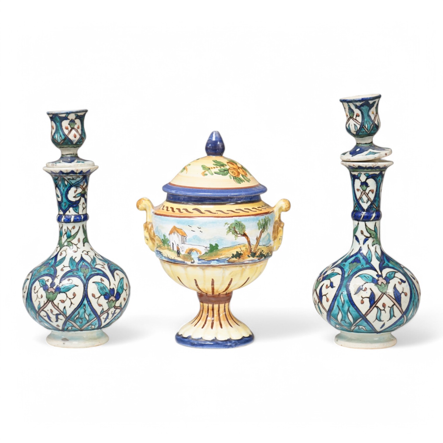 A pair of Isnik pottery vases and majolica vase and cover, largest 22cm high. Condition - fair, some restoration